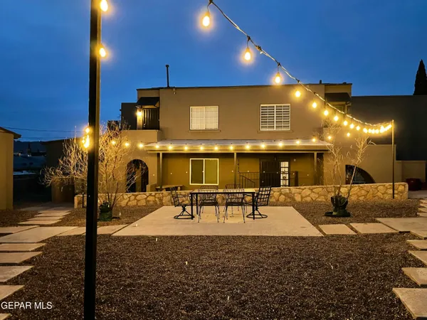 a lobby with furniture and a potted plant