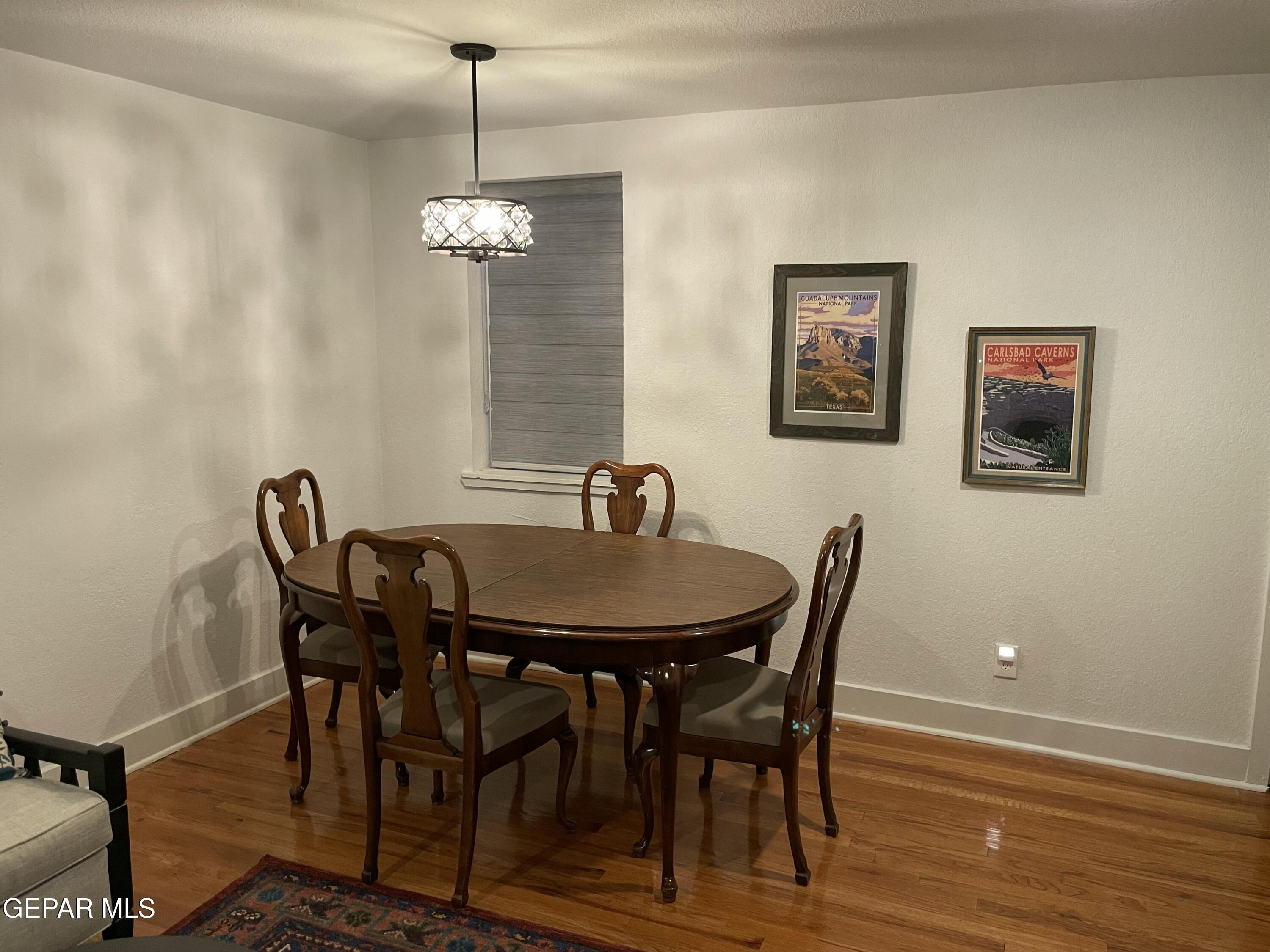 1415 North Ochoa Street, Unit B El Paso, TX 79902 - Photo 4 of 17 a view of a dining room with furniture and wooden floor