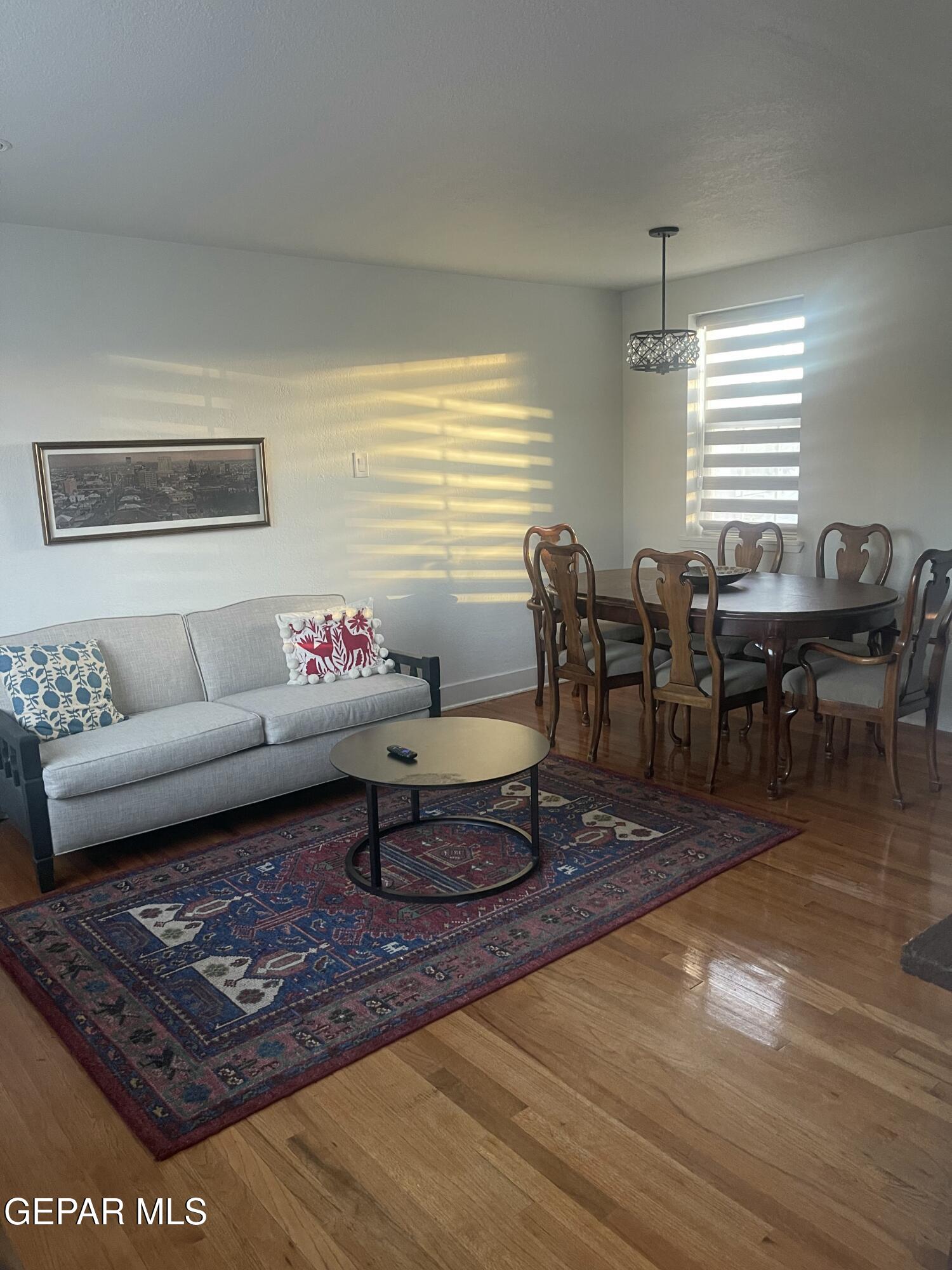 1415 North Ochoa Street, Unit B El Paso, TX 79902 - Photo 7 of 17 a living room with furniture and wooden floor