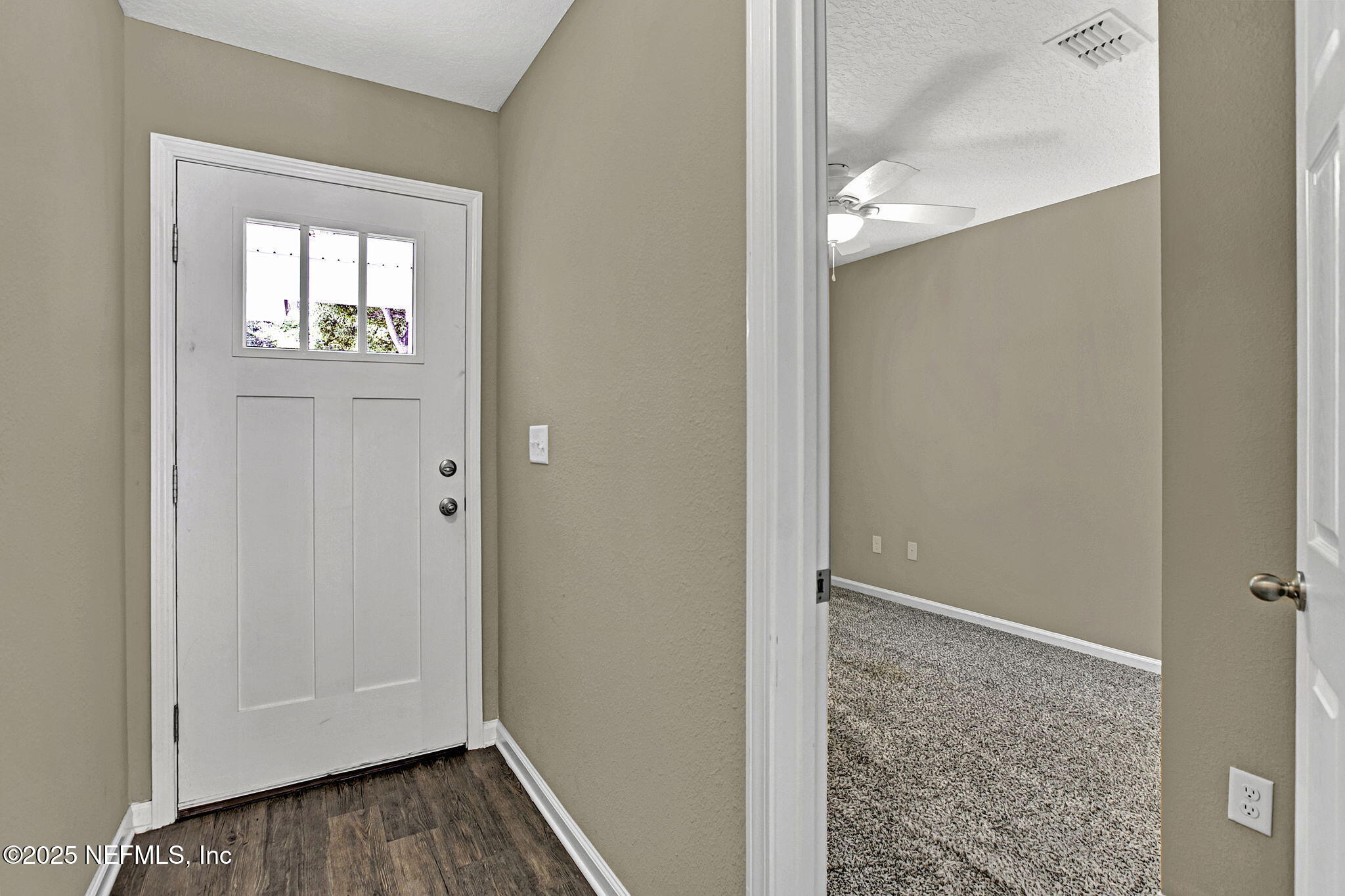 1206 Murray Drive Jacksonville, FL 32205 - Photo 13 of 23 a view of an empty room with wooden floor and a mirror