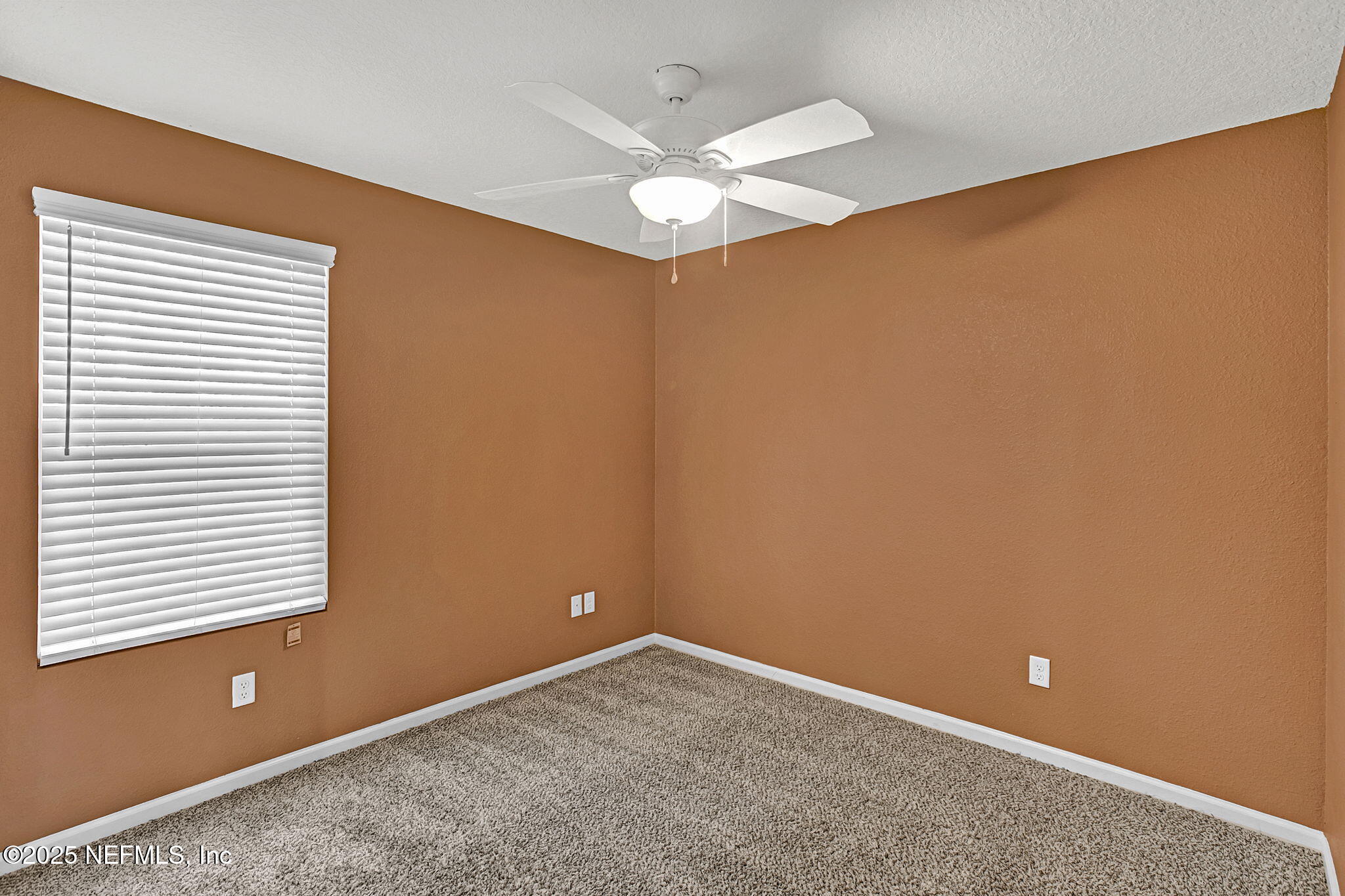 1206 Murray Drive Jacksonville, FL 32205 - Photo 17 of 23 an empty room with a window and a ceiling fan
