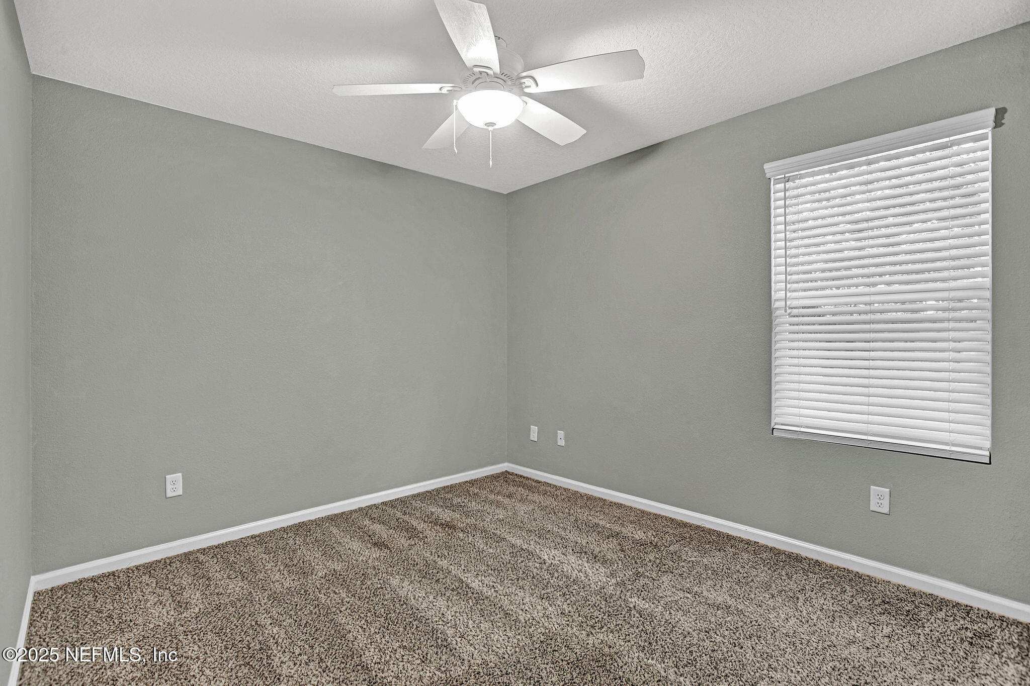 1206 Murray Drive Jacksonville, FL 32205 - Photo 19 of 23 an empty room with a window and a fan