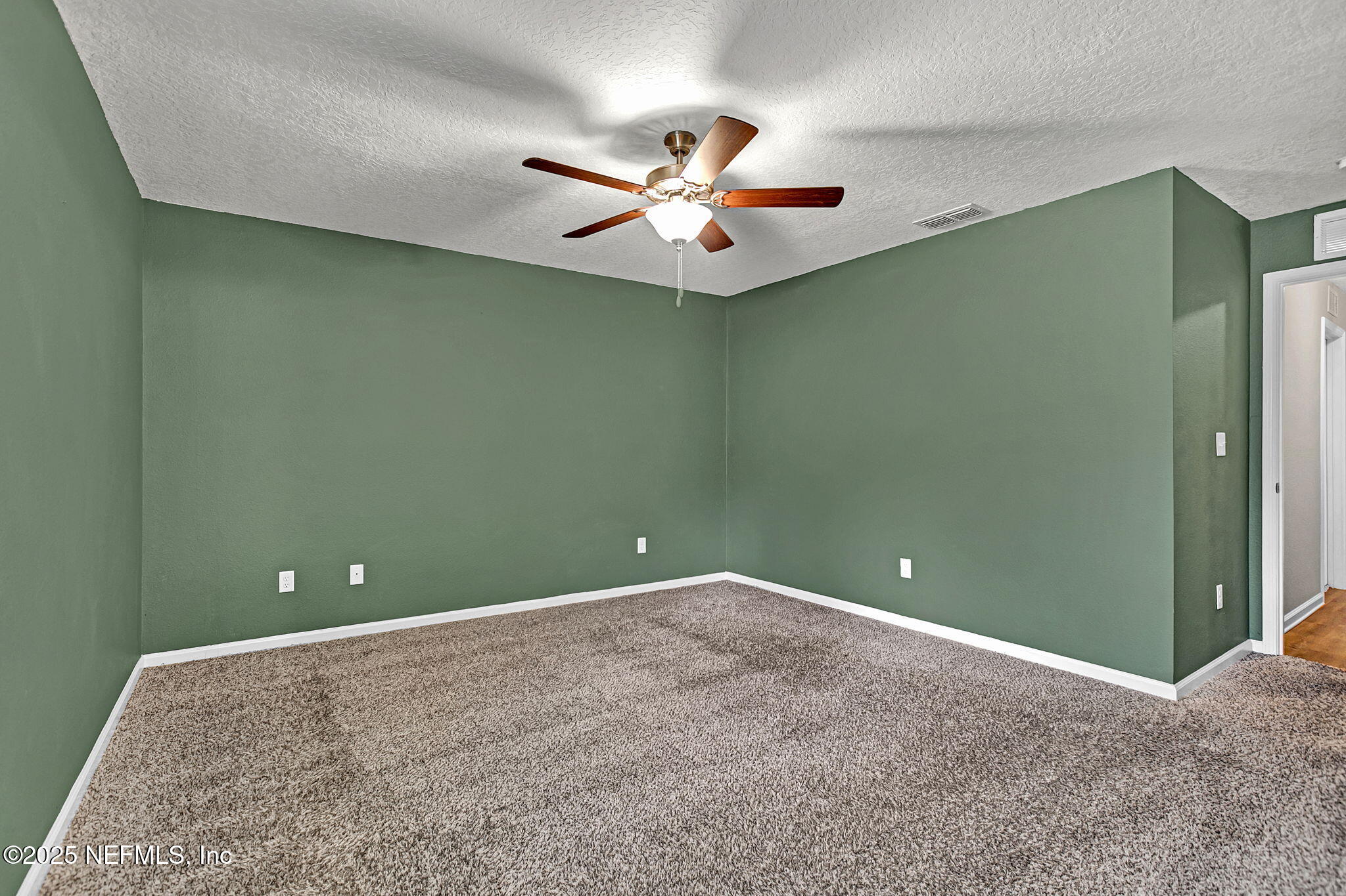 1206 Murray Drive Jacksonville, FL 32205 - Photo 21 of 23 an empty room and chandelier fan