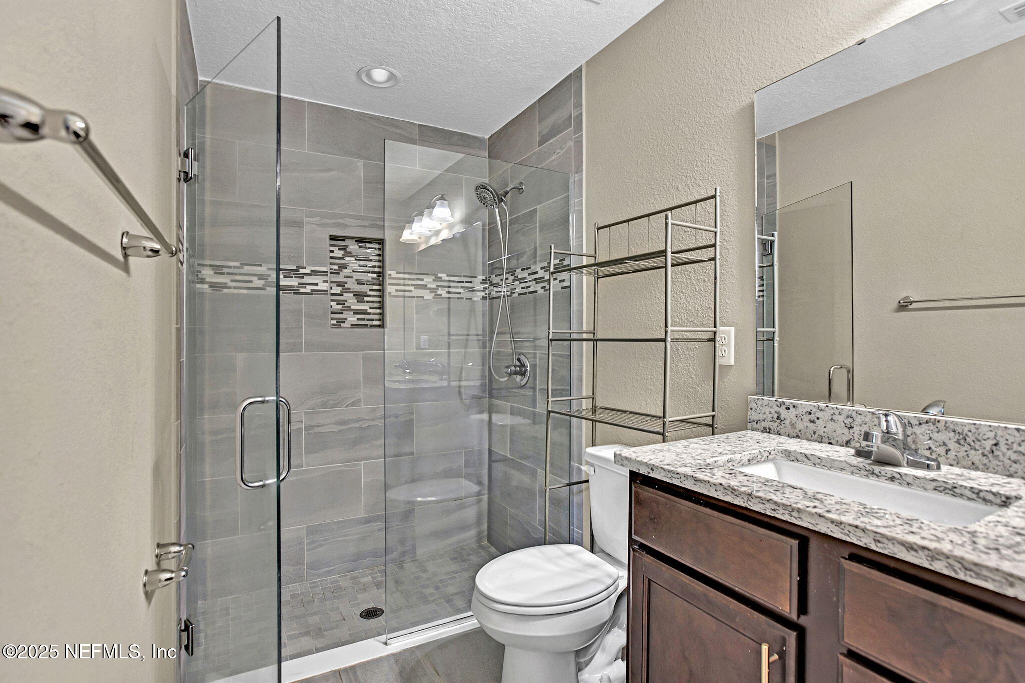 1206 Murray Drive Jacksonville, FL 32205 - Photo 22 of 23 a bathroom with a granite countertop sink toilet and shower