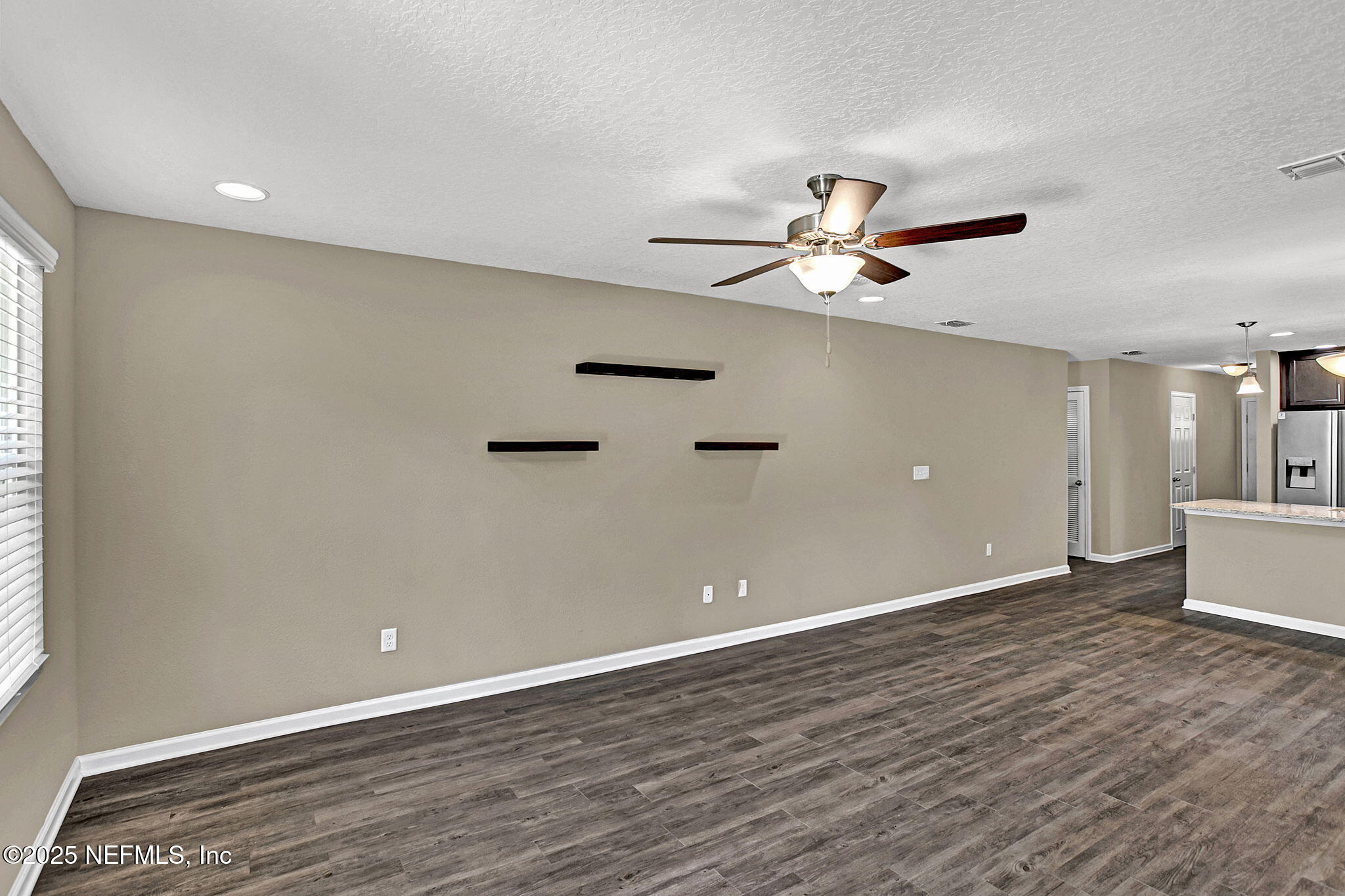 1206 Murray Drive Jacksonville, FL 32205 - Photo 8 of 23 wooden floor in an empty room with a window