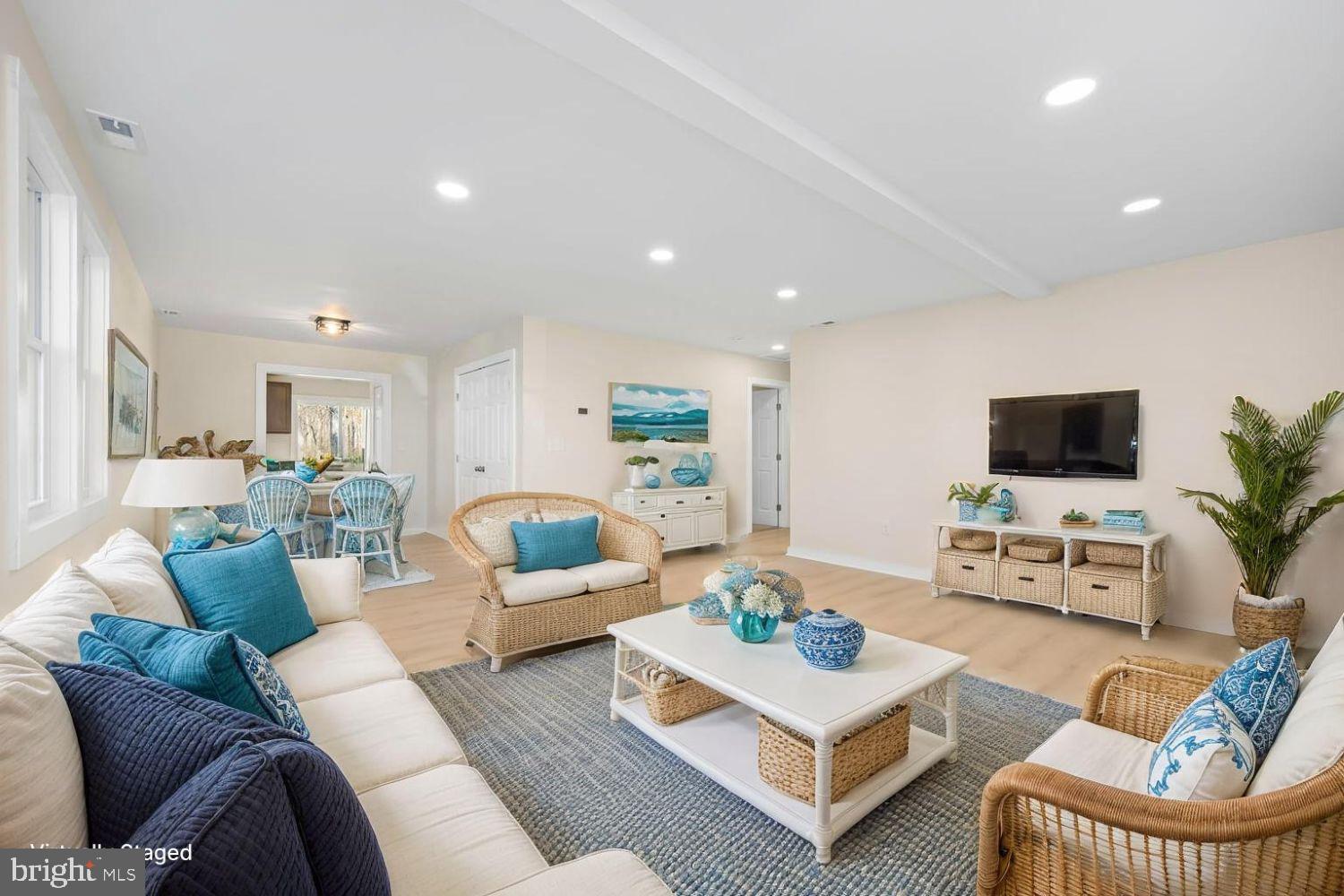 1109 Grasonville Cemetery Road Grasonville, MD 21638 - Photo 11 of 39 a living room with furniture a flat screen tv and a window