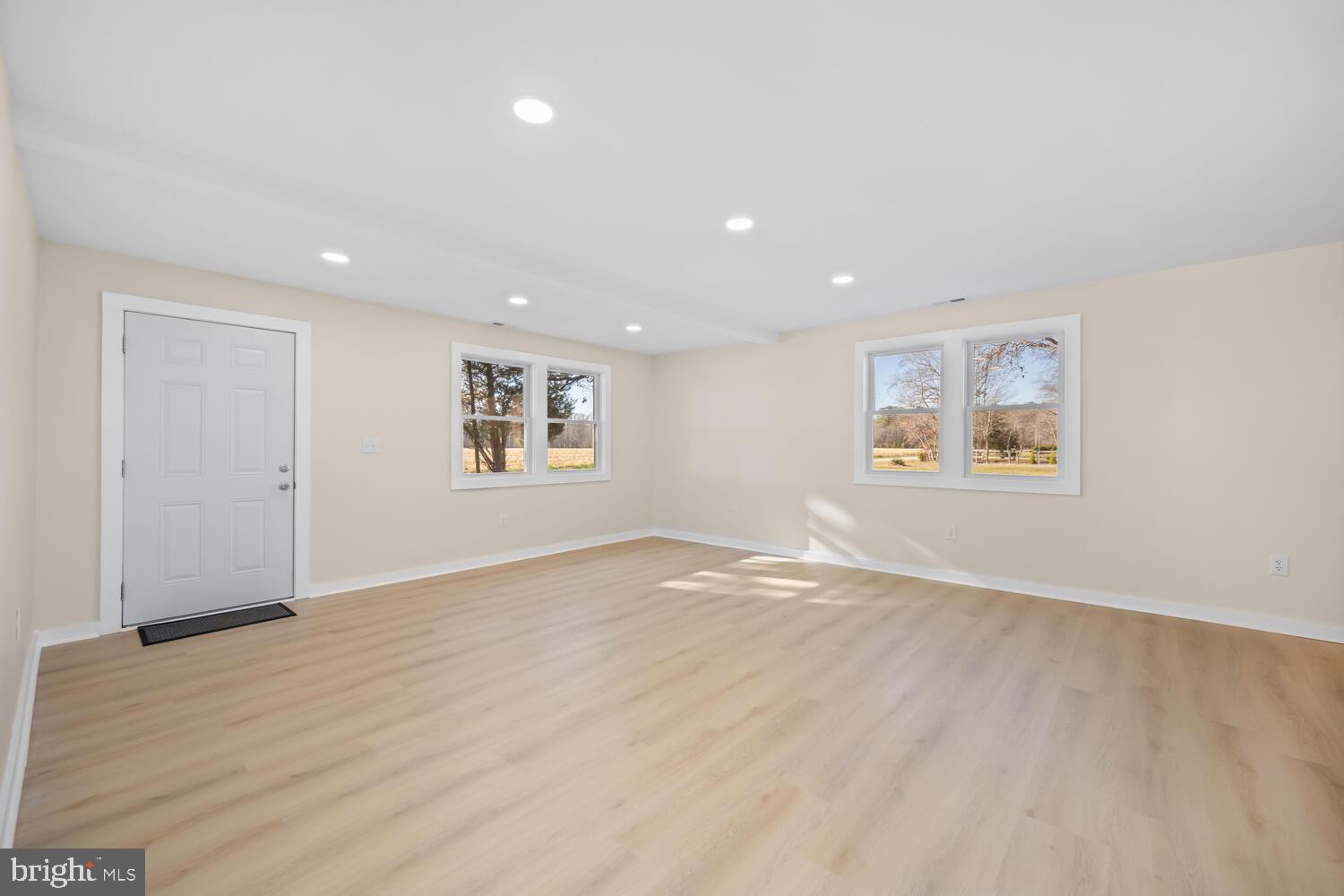 1109 Grasonville Cemetery Road Grasonville, MD 21638 - Photo 13 of 39 a view of empty room with wooden floor and window