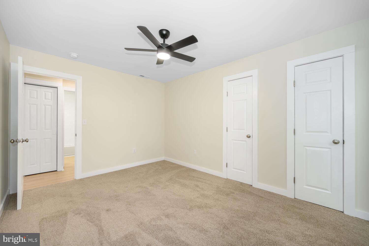 1109 Grasonville Cemetery Road Grasonville, MD 21638 - Photo 18 of 39 a view of a big room with wooden floor closet and windows