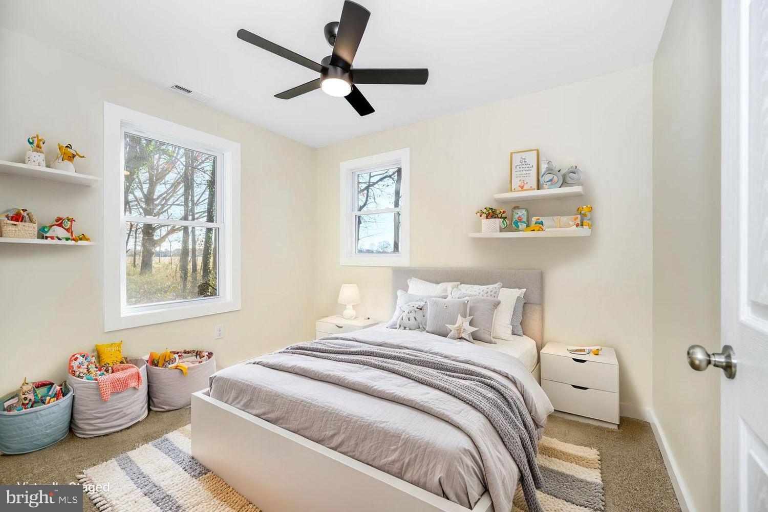 1109 Grasonville Cemetery Road Grasonville, MD 21638 - Photo 23 of 39 a bedroom with a bed and a chandelier