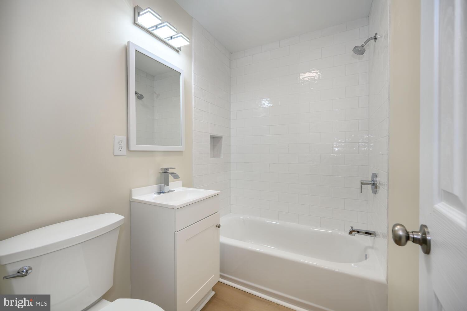 1109 Grasonville Cemetery Road Grasonville, MD 21638 - Photo 26 of 39 a bathroom with a sink toilet vanity and bathtub