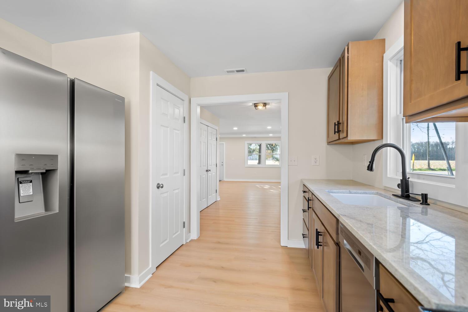 1109 Grasonville Cemetery Road Grasonville, MD 21638 - Photo 10 of 39 a kitchen with granite countertop a sink and cabinets