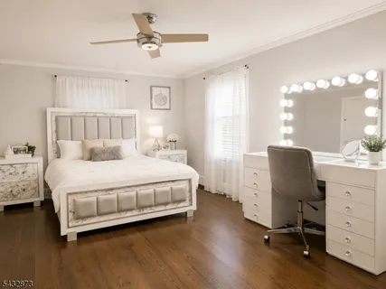 a bedroom with a bed and furniture