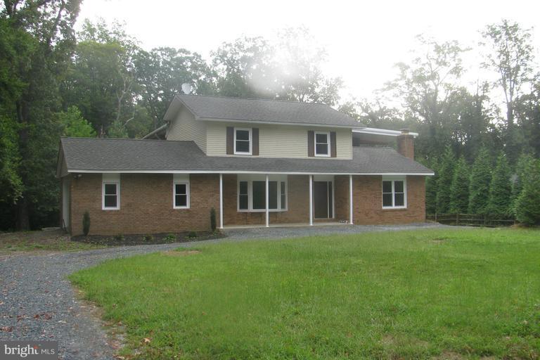 2835 Hambleton Road Riva, MD 21140 - Photo 1 of 30 a front view of a house with a garden