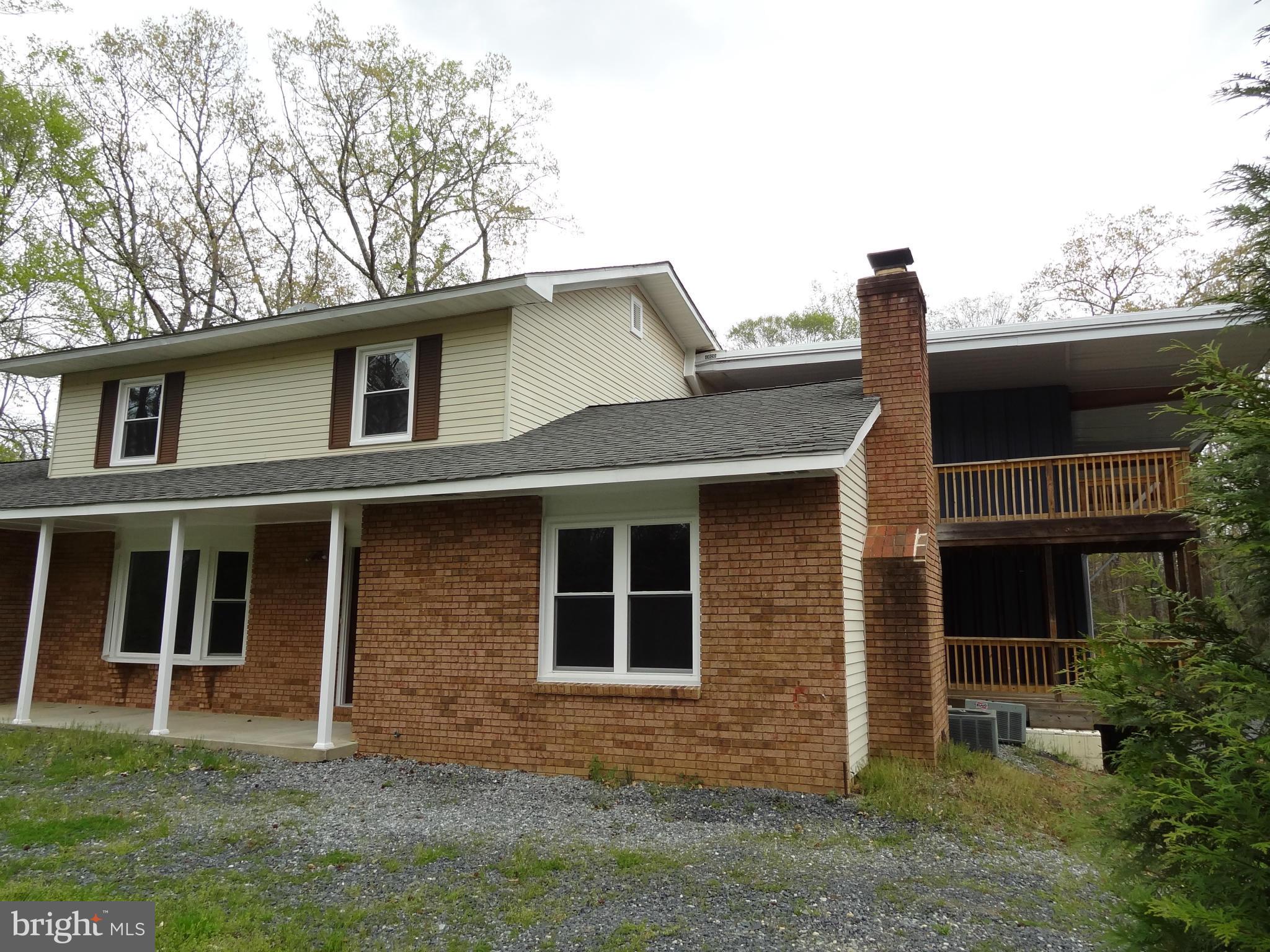 2835 Hambleton Road Riva, MD 21140 - Photo 5 of 30 a front view of a house with garden