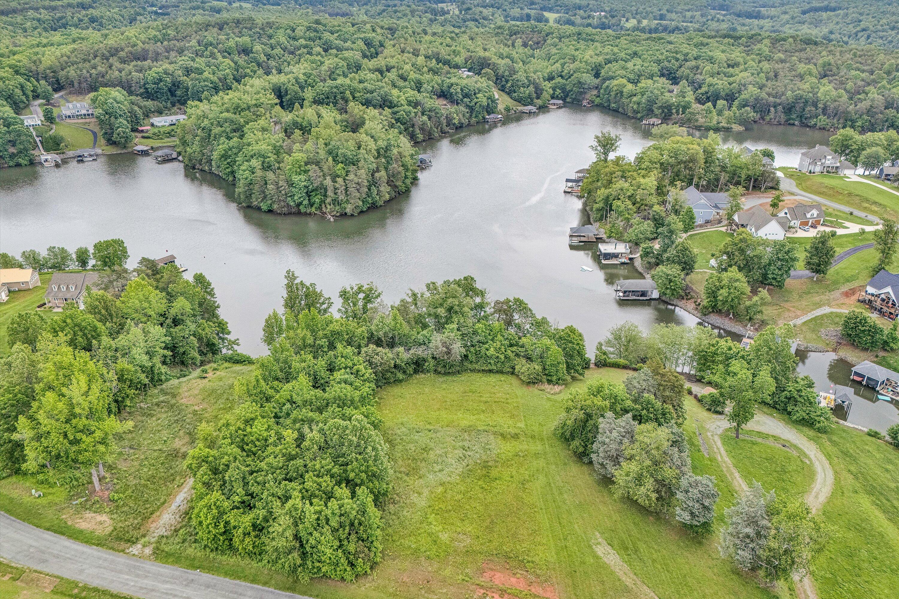 an aerial view of a residential houses with outdoor space