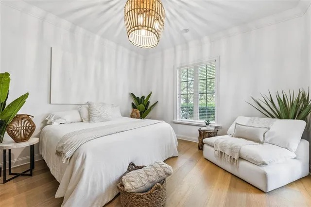 a spacious bedroom with a bed and a couch