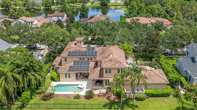 an aerial view of multiple houses with yard