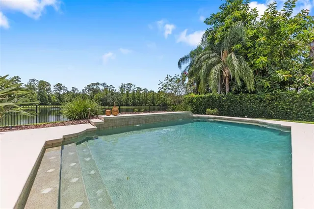 a view of a balcony with yard