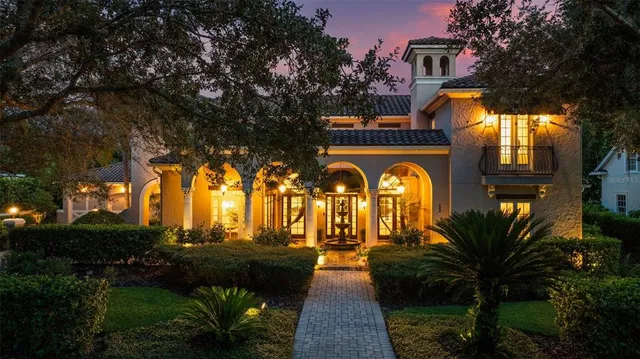 a view of a house with potted plants
