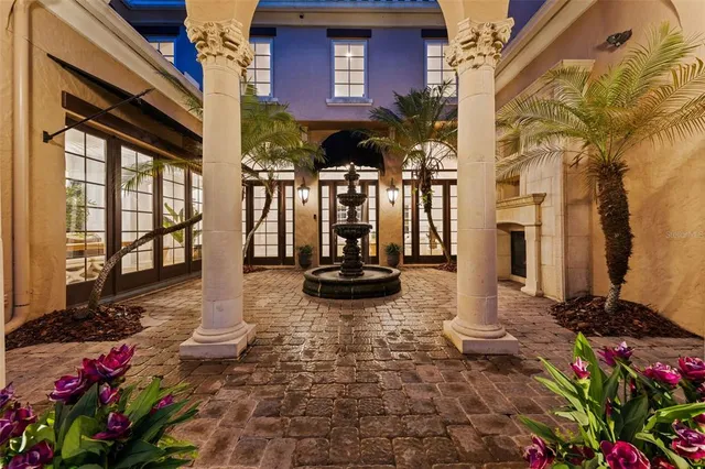a view of a chairs and table in the patio