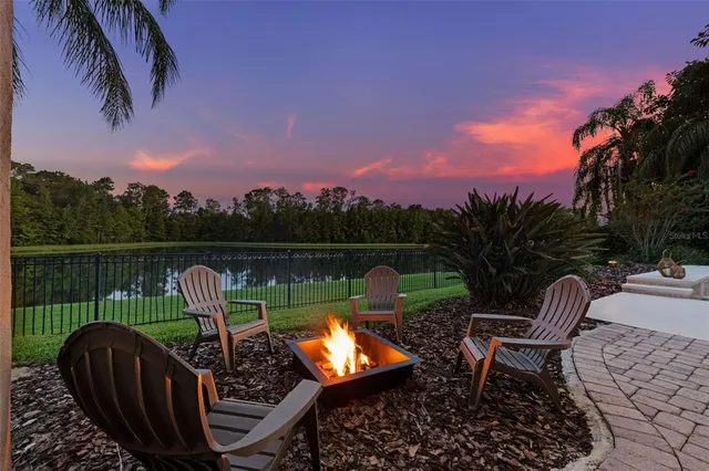 a building outdoor space with patio furniture and potted plants