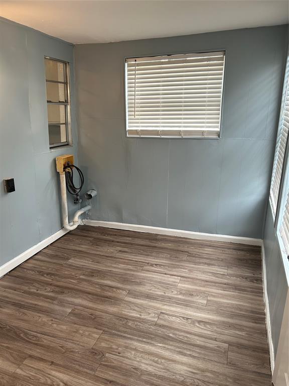 409 Wildwood Drive Mesquite, TX 75149 - Photo 7 of 9 a view of a room with wooden floor and a window