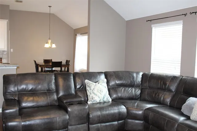 a living room with a couch and a window