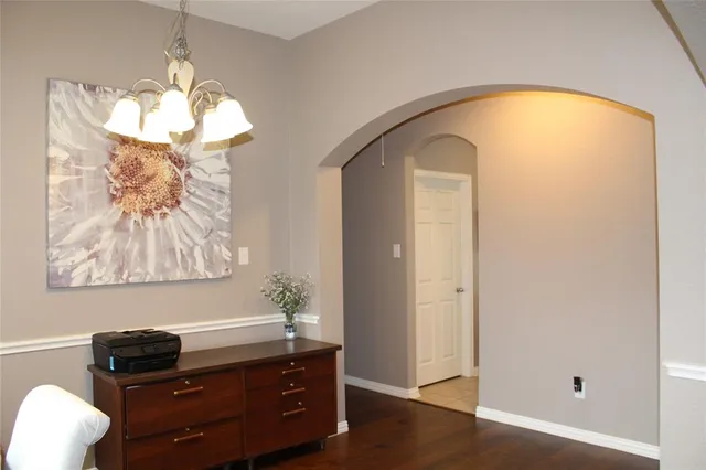 a room with a cabinet and a mirror