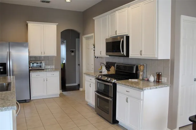 a kitchen with a stove microwave and refrigerator