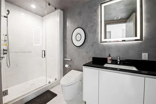 a utility room with sink dryer and washer