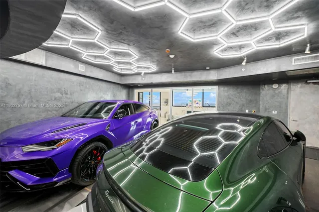 a kitchen with stainless steel appliances kitchen island granite countertop a table and chairs in it