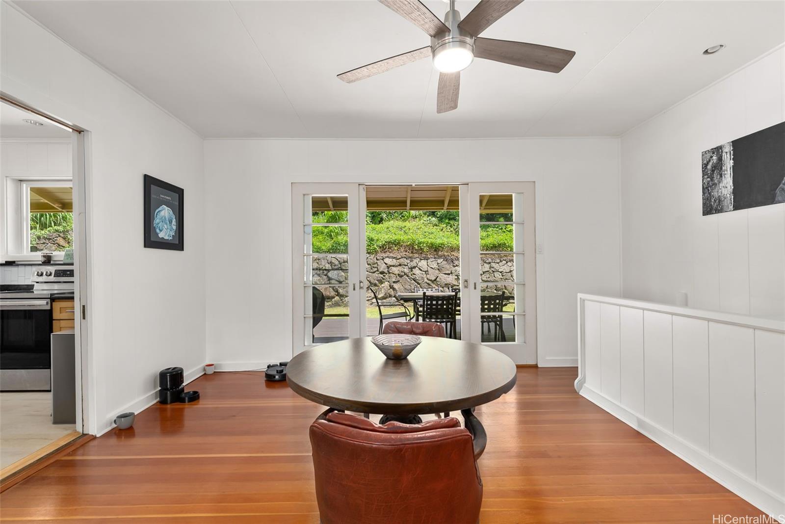 2811 Henry Street Honolulu, HI 96817 - Photo 6 of 25 A seamless transition from the elegant dining area straight out to the magnificent deck makes this the ultimate home for island-style entertaining.