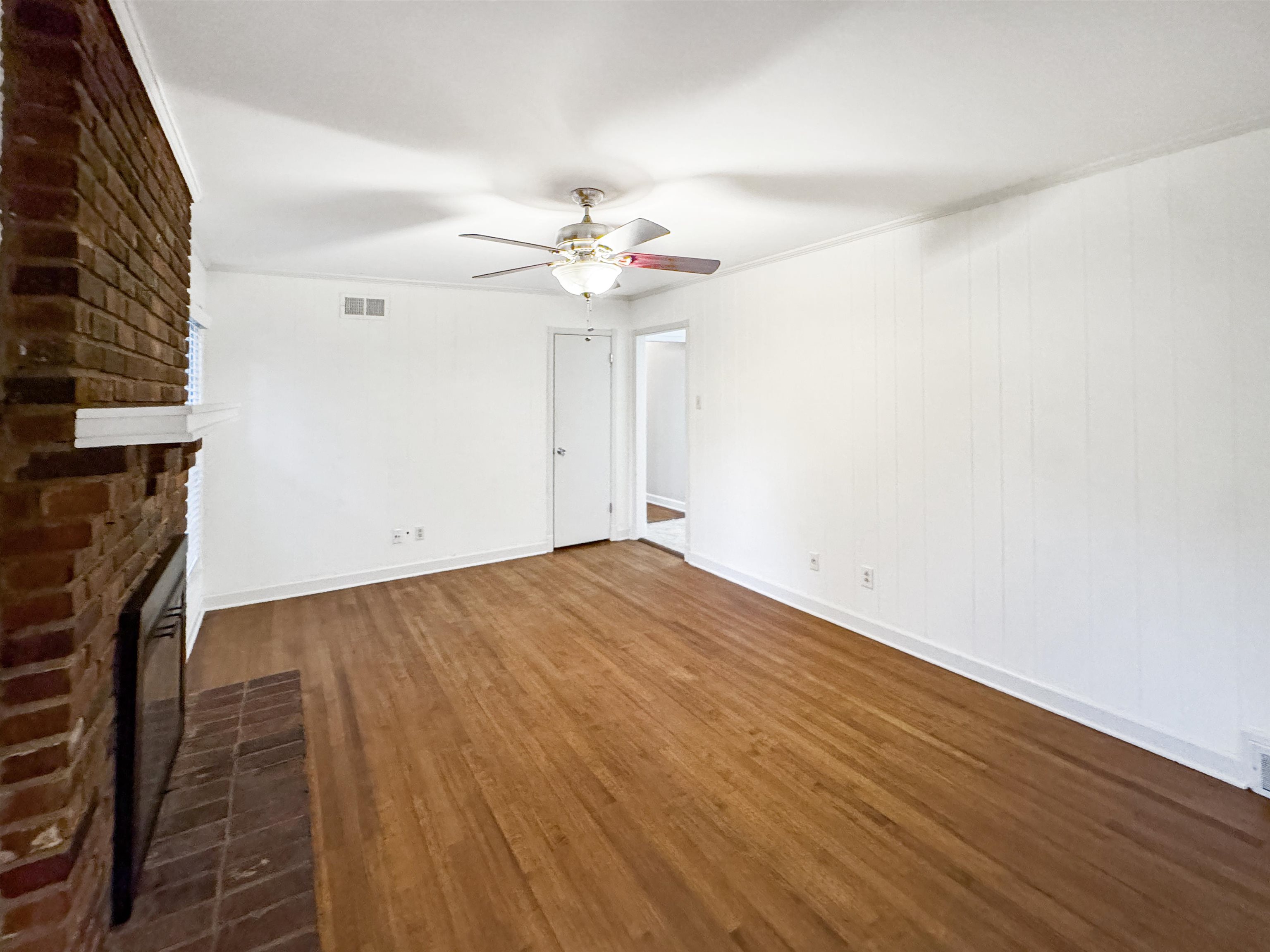 407 Meadvale Road Memphis, TN 38120 - Photo 16 of 36 wooden floor in an empty room