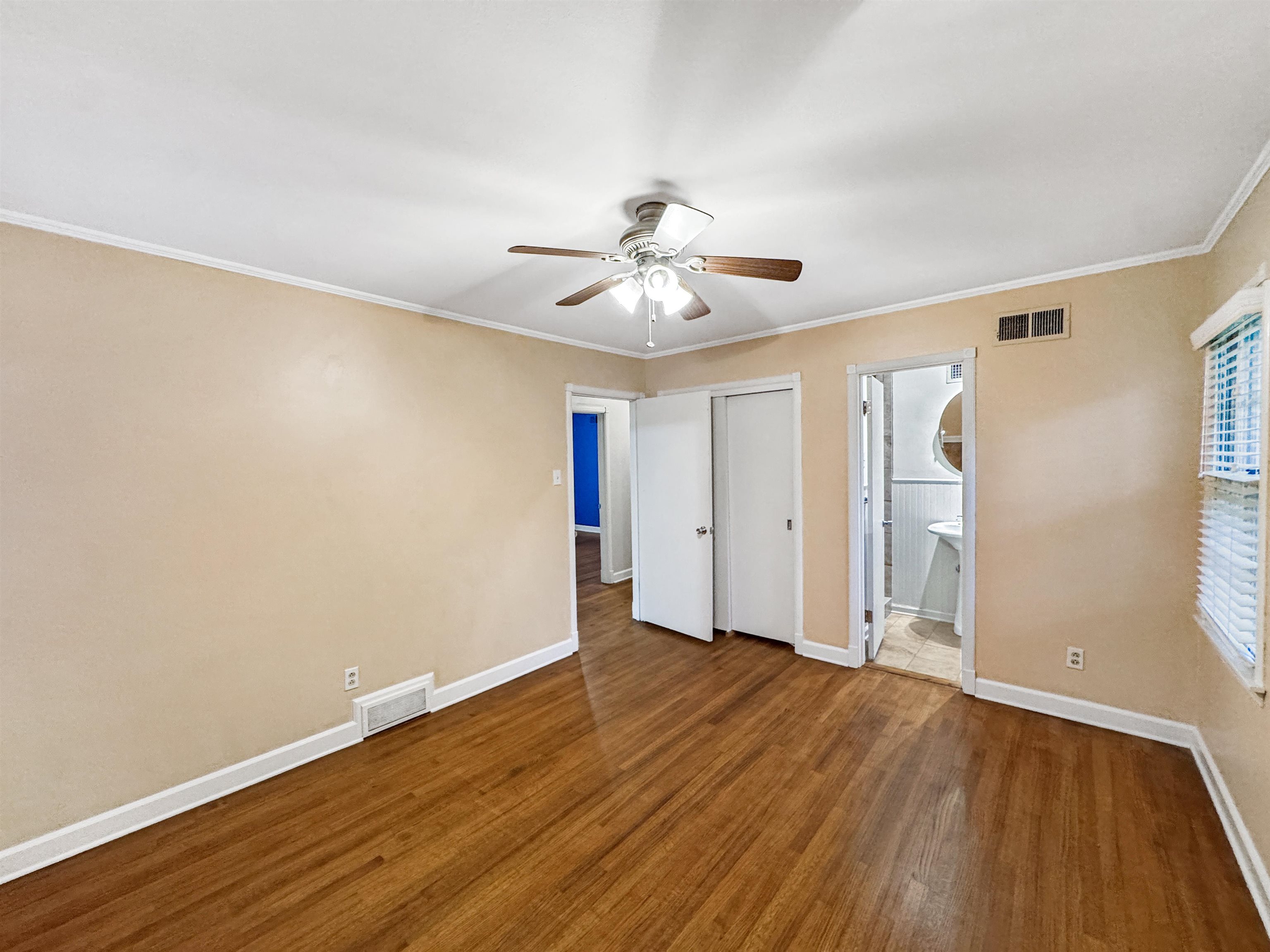 407 Meadvale Road Memphis, TN 38120 - Photo 30 of 36 a view of an empty room with wooden floor