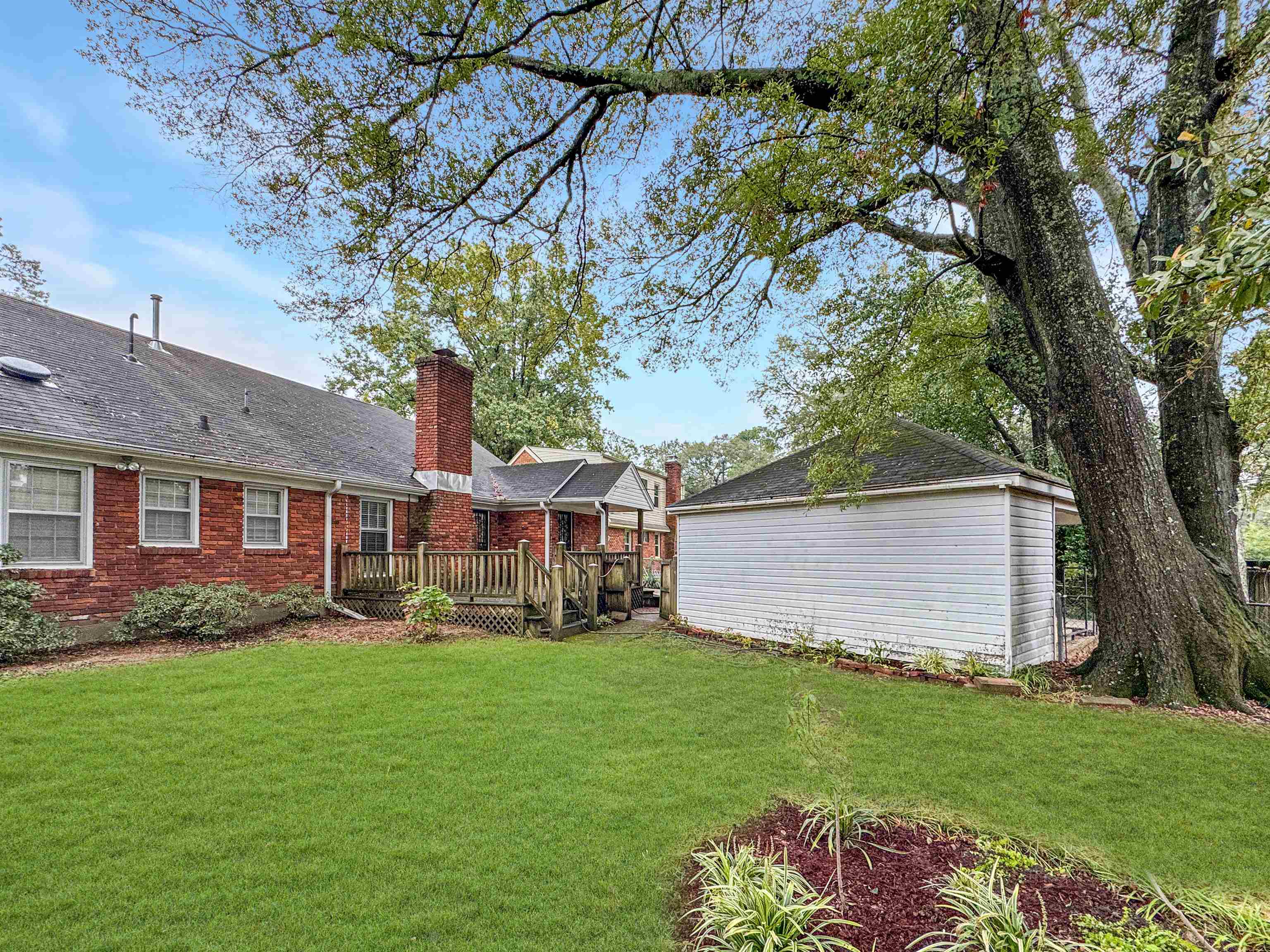 407 Meadvale Road Memphis, TN 38120 - Photo 33 of 36 a front view of house with yard and green space
