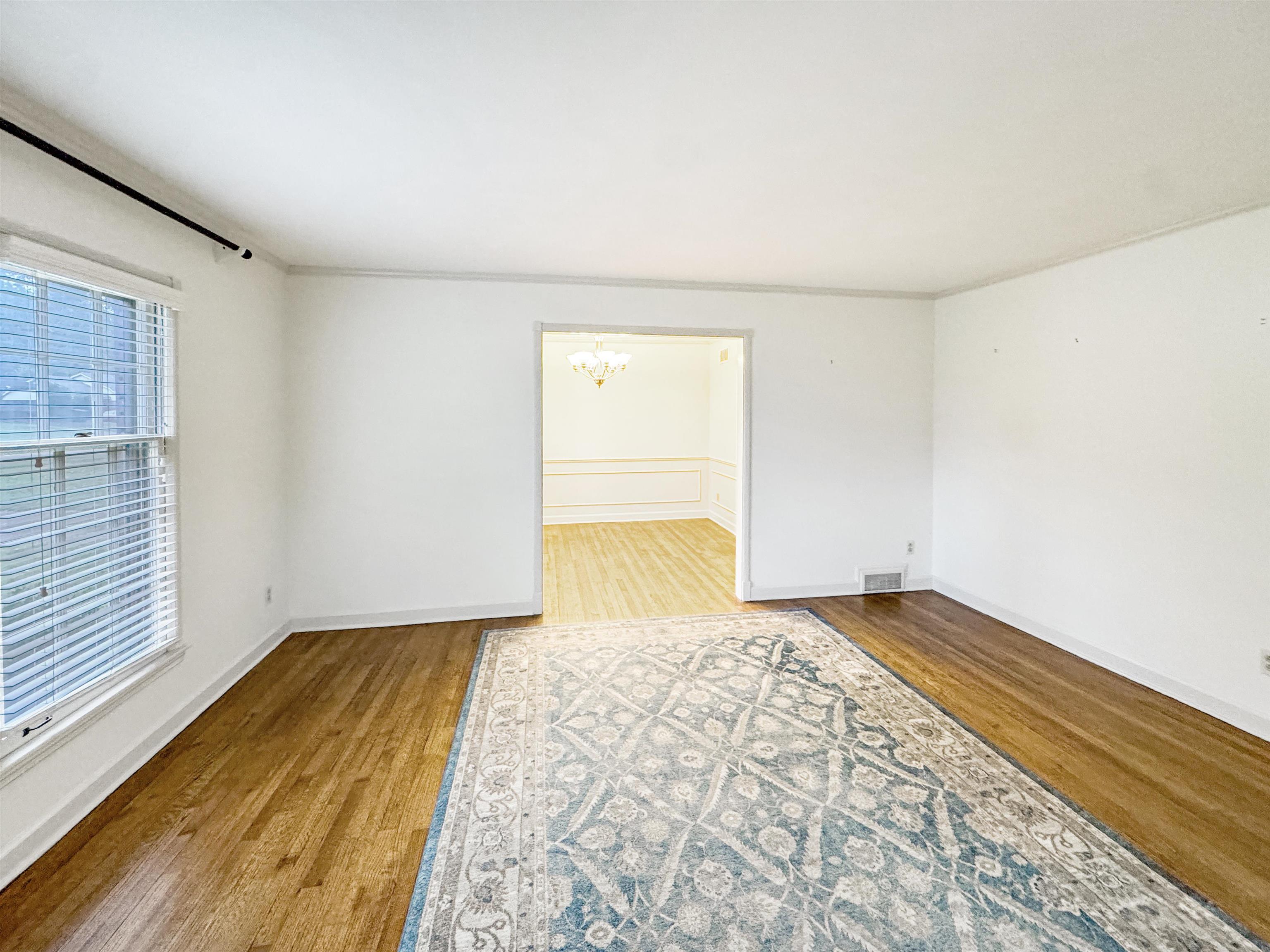 407 Meadvale Road Memphis, TN 38120 - Photo 4 of 36 a view of a room with wooden floor