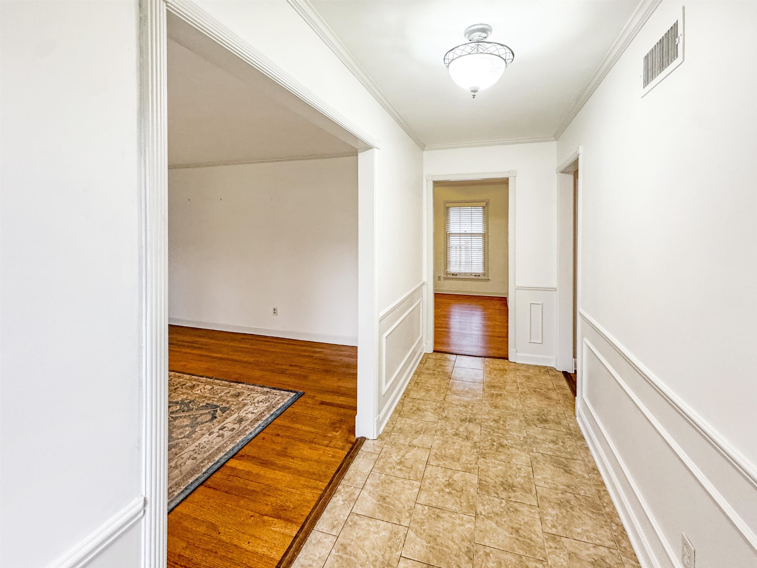 407 Meadvale Road Memphis, TN 38120 - Photo 4 of 37 a view of hallway with wooden floor