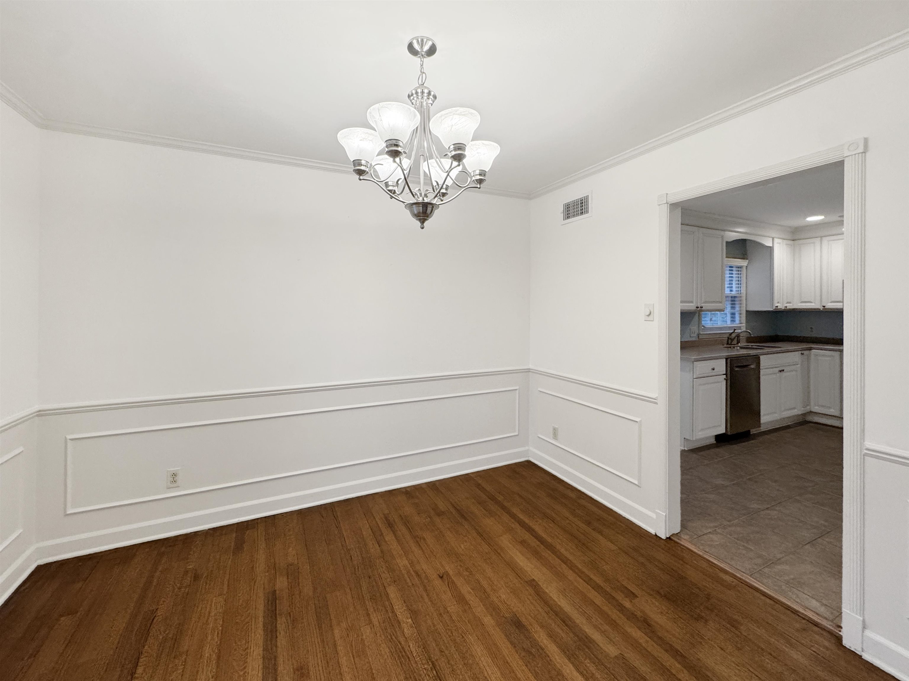 407 Meadvale Road Memphis, TN 38120 - Photo 8 of 37 a view of cabinets and wooden floor