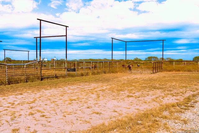 a view of a swimming pool with an outdoor seating