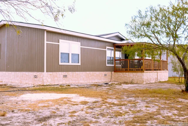 a front view of a house with swimming pool