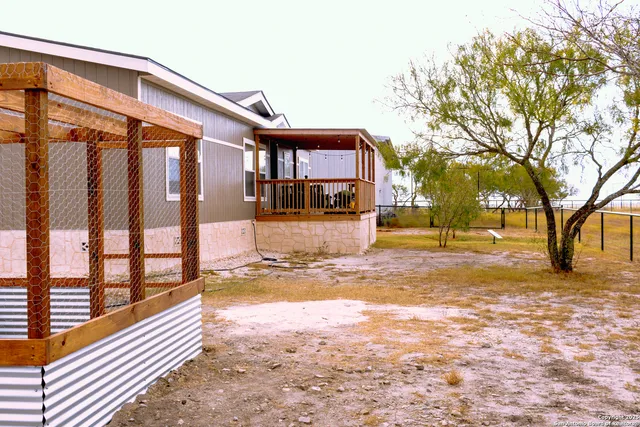 a front view of a house with a swimming pool
