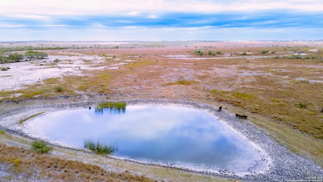 a view of swimming pool with outdoor seating