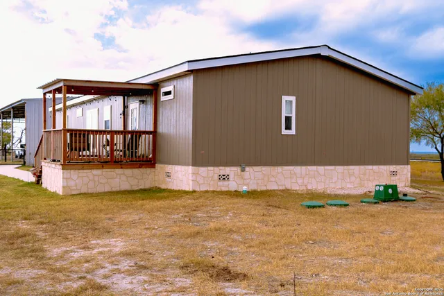 a view of swimming pool with an outdoor seating