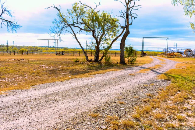 a view of a house with swimming pool and sitting area
