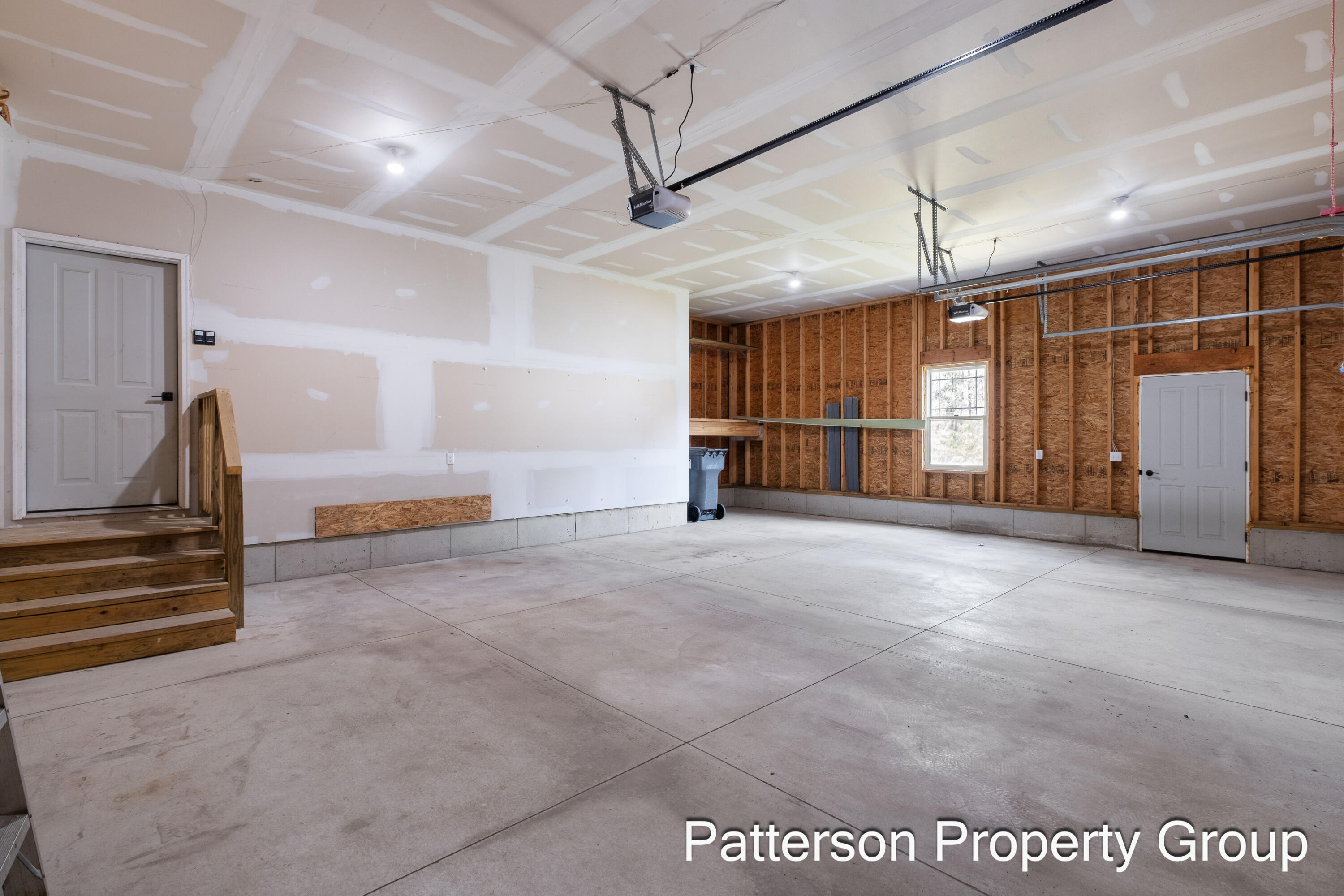 7616 East Sheringer Road Ravenna, MI 49451 - Photo 52 of 55 Three stall attached garage