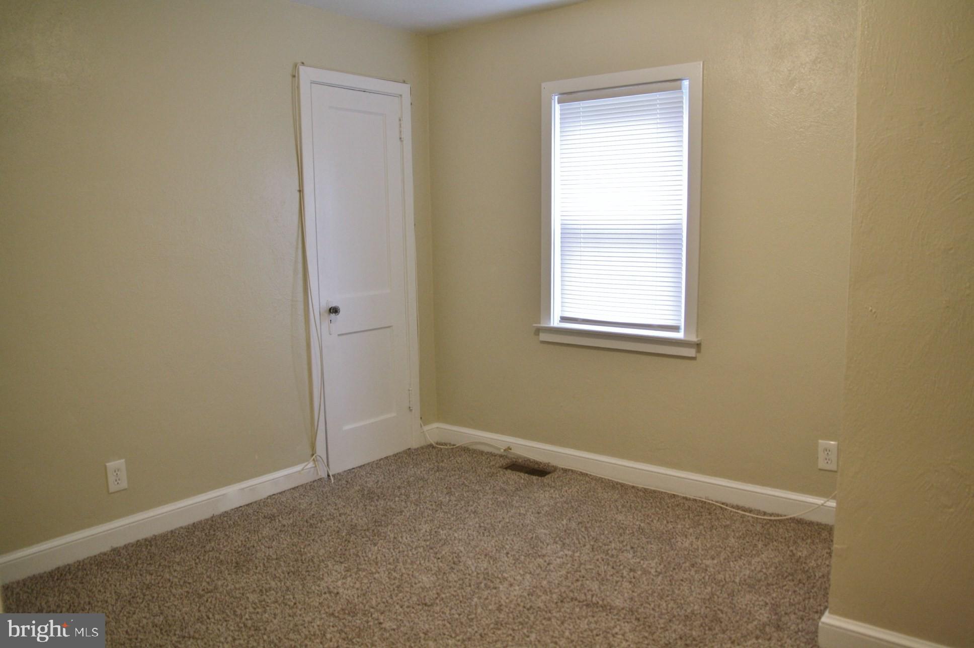 4004 Walnut Street, Unit A2 Harrisburg, PA 17109 - Photo 8 of 8 an empty room with windows and closet