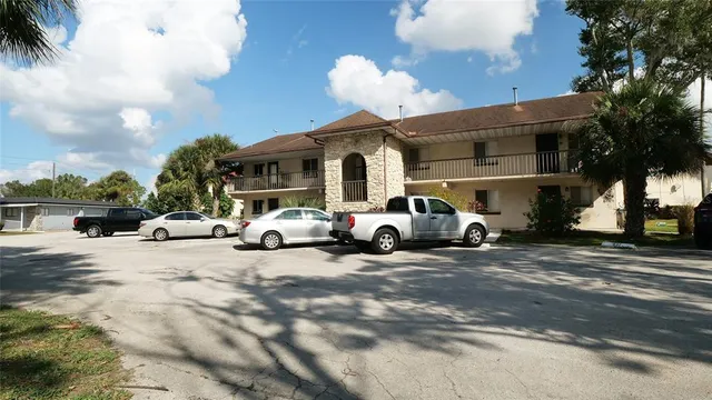 a group of cars parked in front of a house