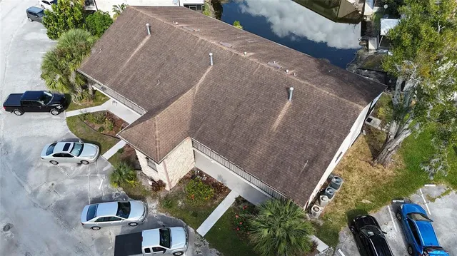 an aerial view of houses with yard