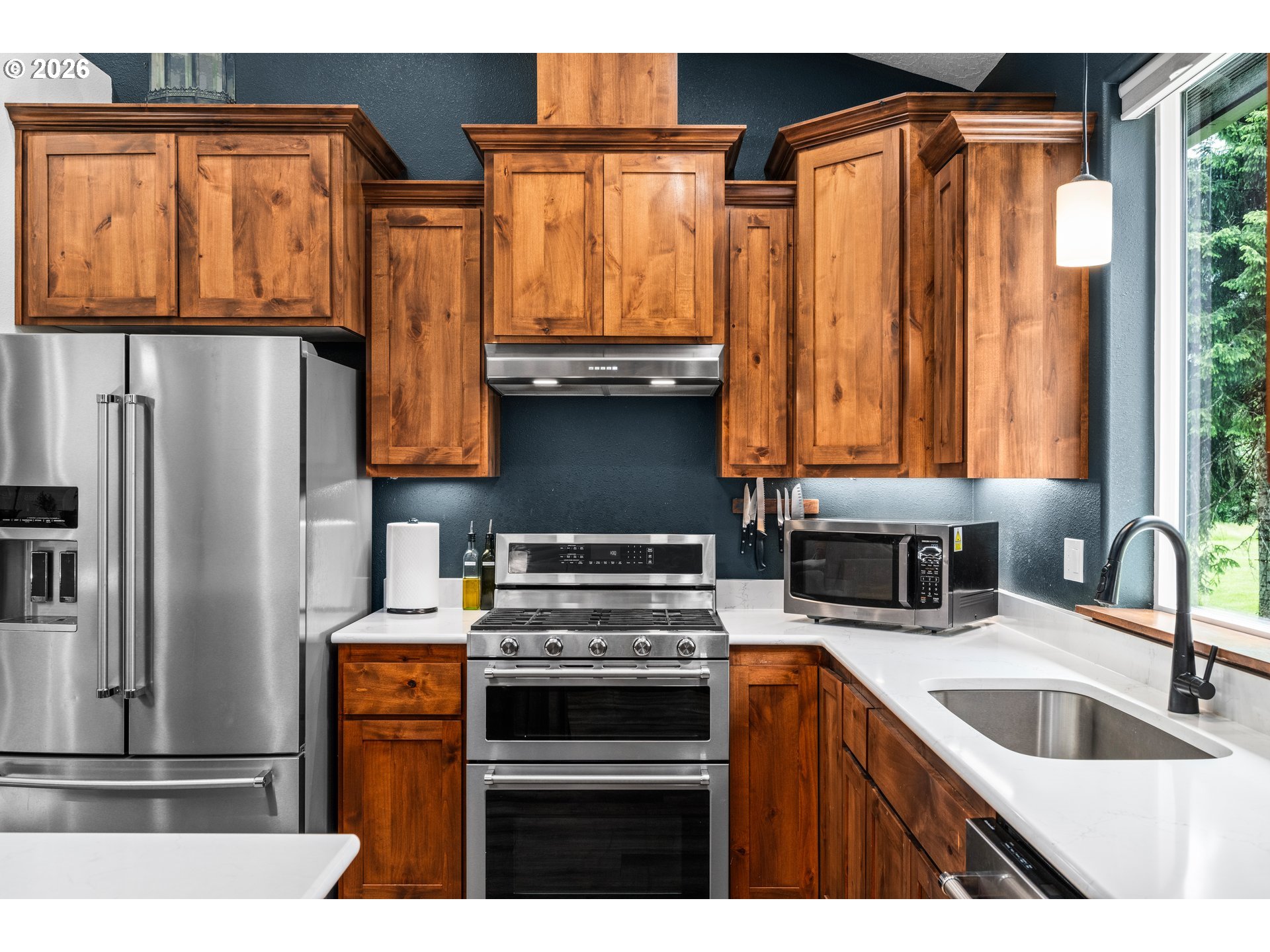 45542 South Gate Creek Road Vida, OR 97488 - Photo 30 of 46 a kitchen with granite countertop a refrigerator and a sink