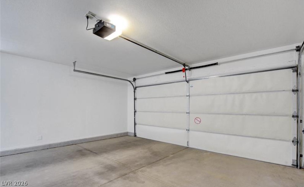 2716 Showcase Drive Las Vegas, NV 89134 - Photo 32 of 45 Secure parking is provided by this well-maintained garage, featuring an automatic door opener and ample space.